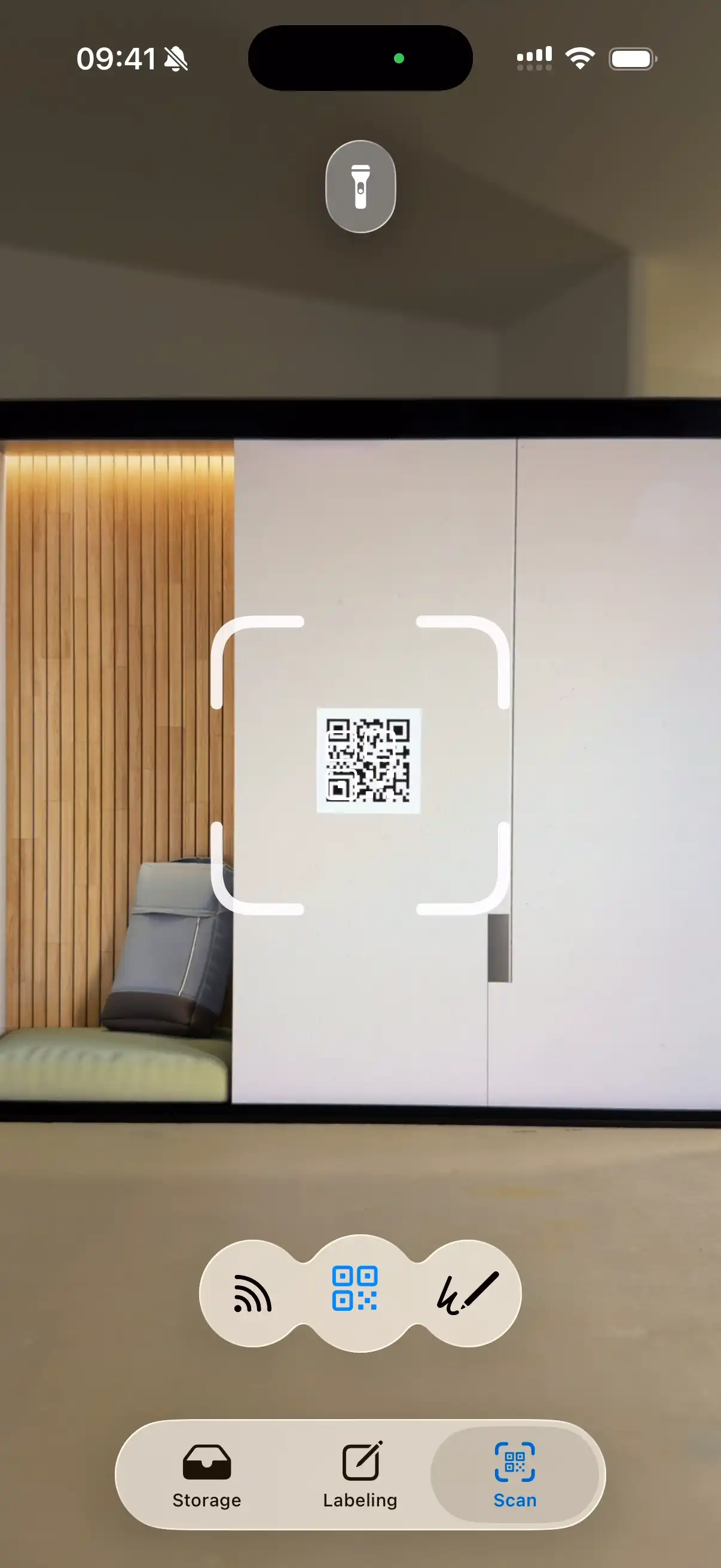 WatInside app camera scanning a QR code label on a wardrobe